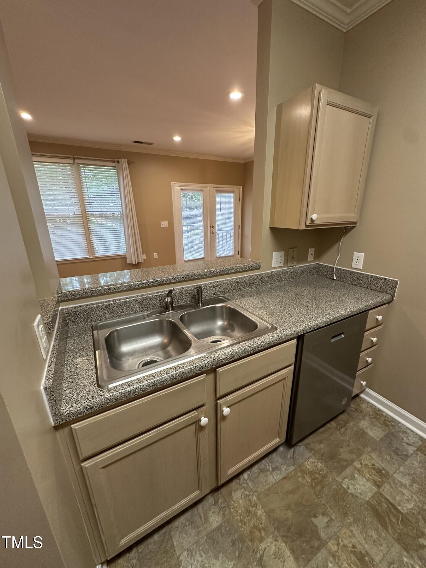 710 North Person Street, Unit 103 Raleigh, NC 27604 - Photo 8 of 16 a kitchen with a sink and cabinets