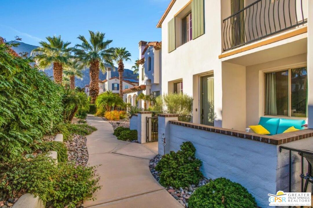 435 Copper Canyon Road, Unit 23 Palm Springs, CA 92262 - Photo 1 of 28 a view of a chair and table in the patio in front of a house