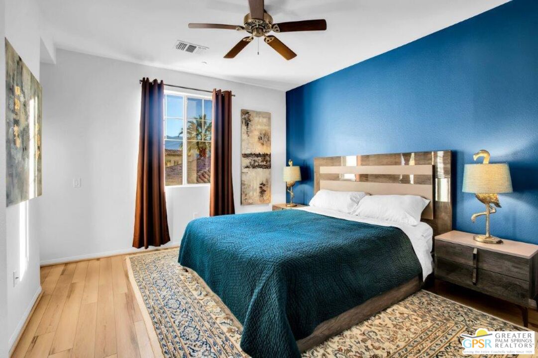 435 Copper Canyon Road, Unit 23 Palm Springs, CA 92262 - Photo 12 of 28 a bedroom with a bed and a window