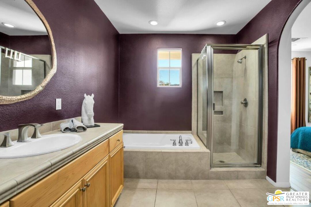435 Copper Canyon Road, Unit 23 Palm Springs, CA 92262 - Photo 14 of 28 a bathroom with a granite countertop sink a mirror and shower