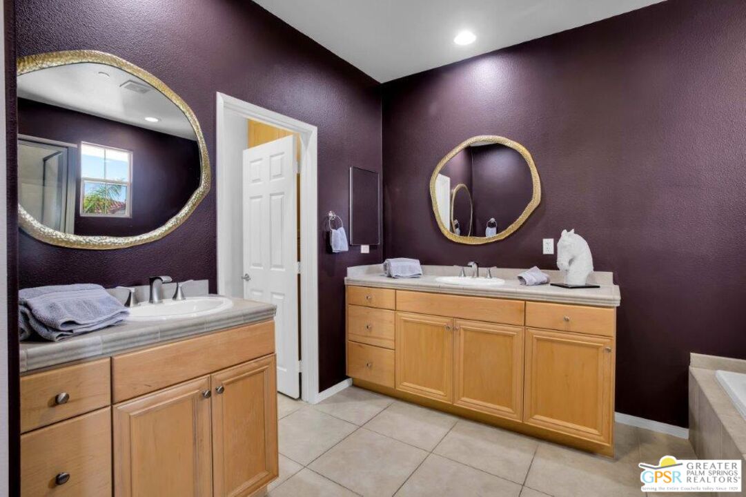 435 Copper Canyon Road, Unit 23 Palm Springs, CA 92262 - Photo 15 of 28 a bathroom with a sink and a mirror