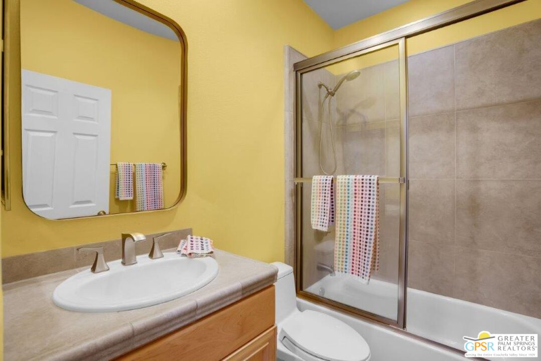 435 Copper Canyon Road, Unit 23 Palm Springs, CA 92262 - Photo 21 of 28 a bathroom with a sink toilet and shower