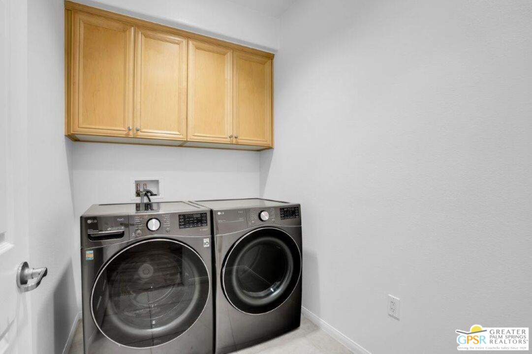 435 Copper Canyon Road, Unit 23 Palm Springs, CA 92262 - Photo 22 of 28 a utility room with dryer and washer