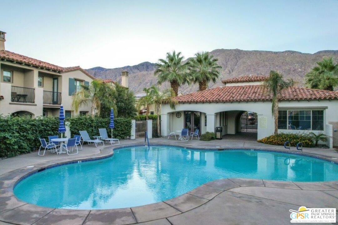 435 Copper Canyon Road, Unit 23 Palm Springs, CA 92262 - Photo 25 of 28 a view of a house with swimming pool and a sitting area