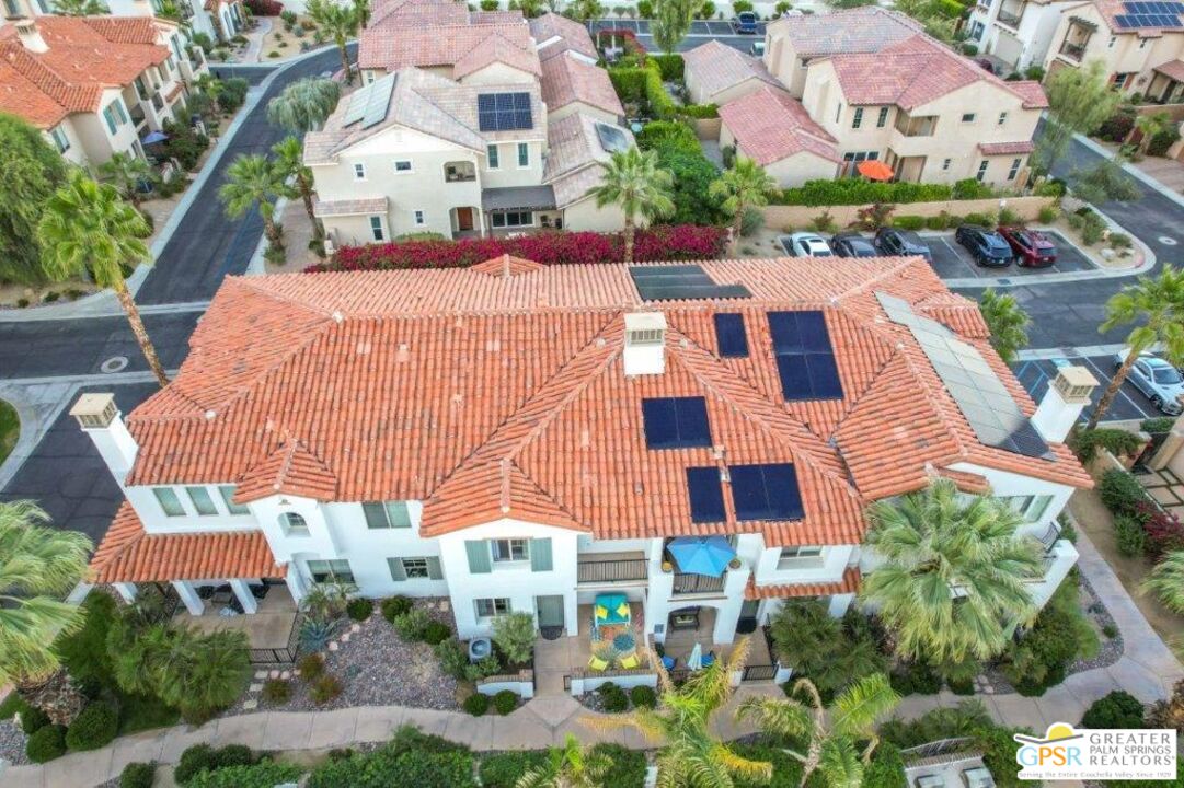 435 Copper Canyon Road, Unit 23 Palm Springs, CA 92262 - Photo 27 of 28 an aerial view of multiple houses with a yard