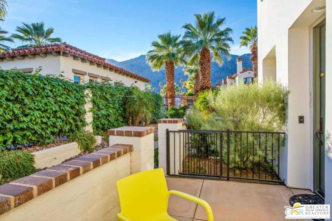 435 Copper Canyon Road, Unit 23 Palm Springs, CA 92262 - Photo 3 of 28 a view of a swimming pool with a patio