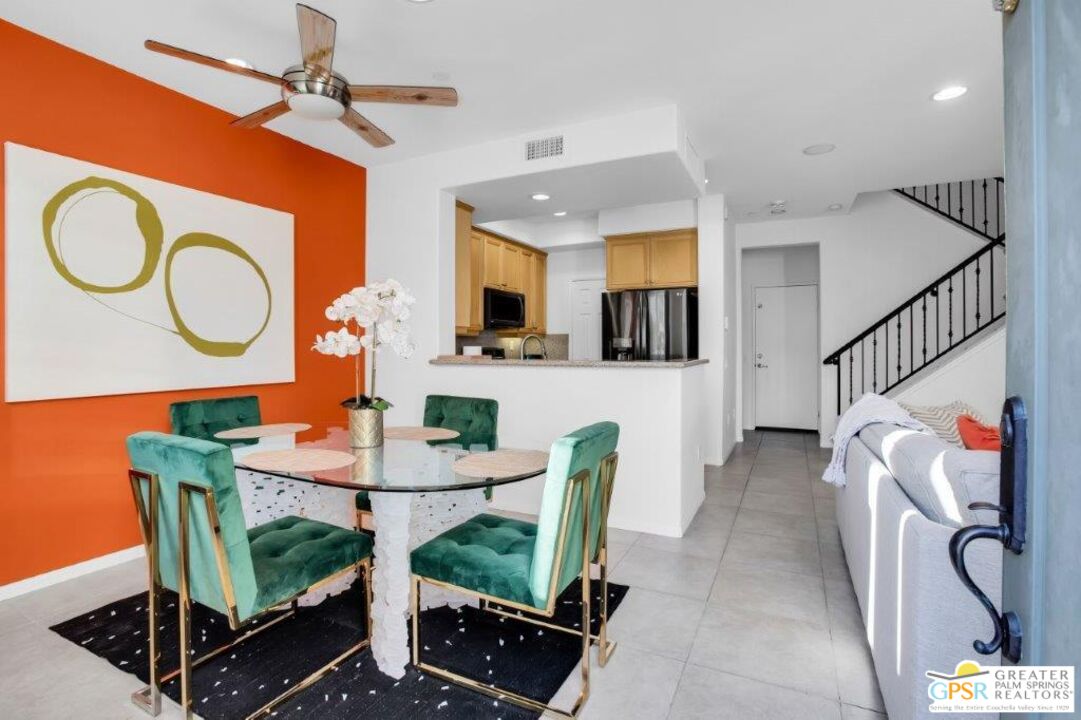 435 Copper Canyon Road, Unit 23 Palm Springs, CA 92262 - Photo 5 of 28 a living room with furniture a rug and white walls