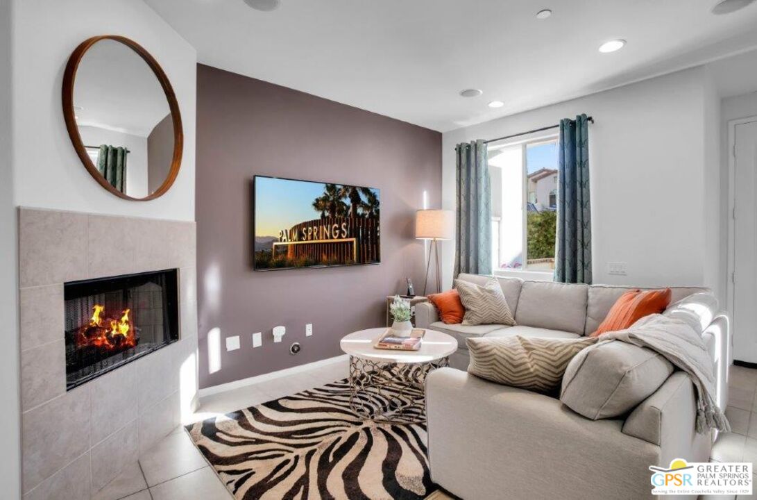 435 Copper Canyon Road, Unit 23 Palm Springs, CA 92262 - Photo 6 of 28 a living room with furniture and a fireplace