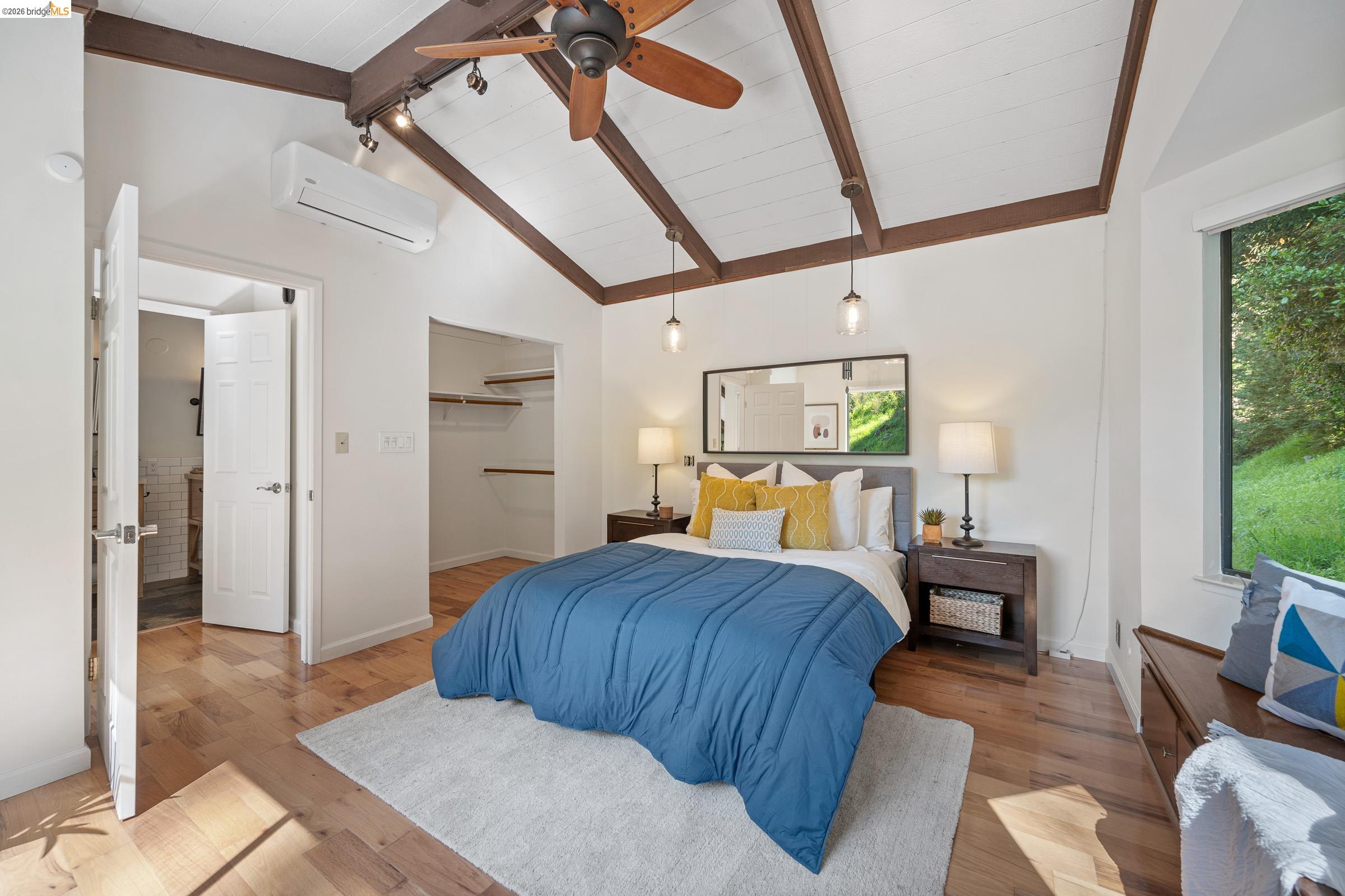 6600 Heather Ridge Way Oakland, CA 94611 - Photo 41 of 66 Vaulted ceiling with exposed wood beams and a ceiling fan