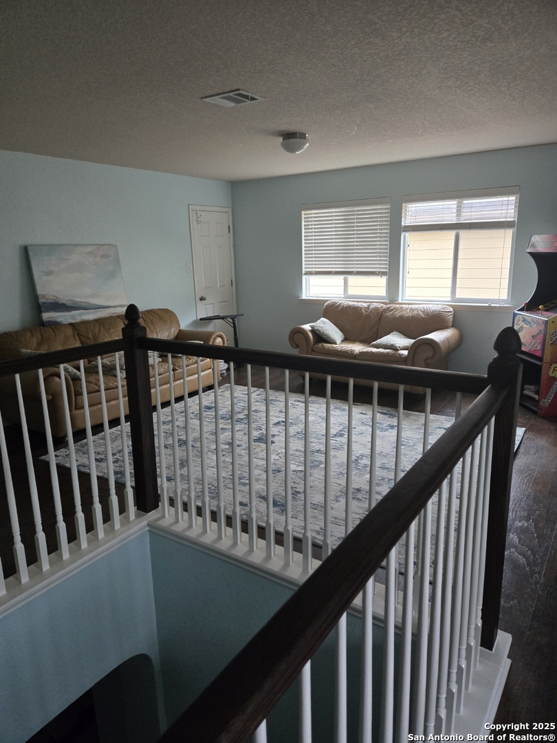 225 Kensington Drive Cibolo, TX 78108 - Photo 3 of 5 a view of entryway with wooden floor