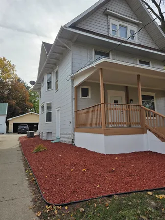 a view of house with yard