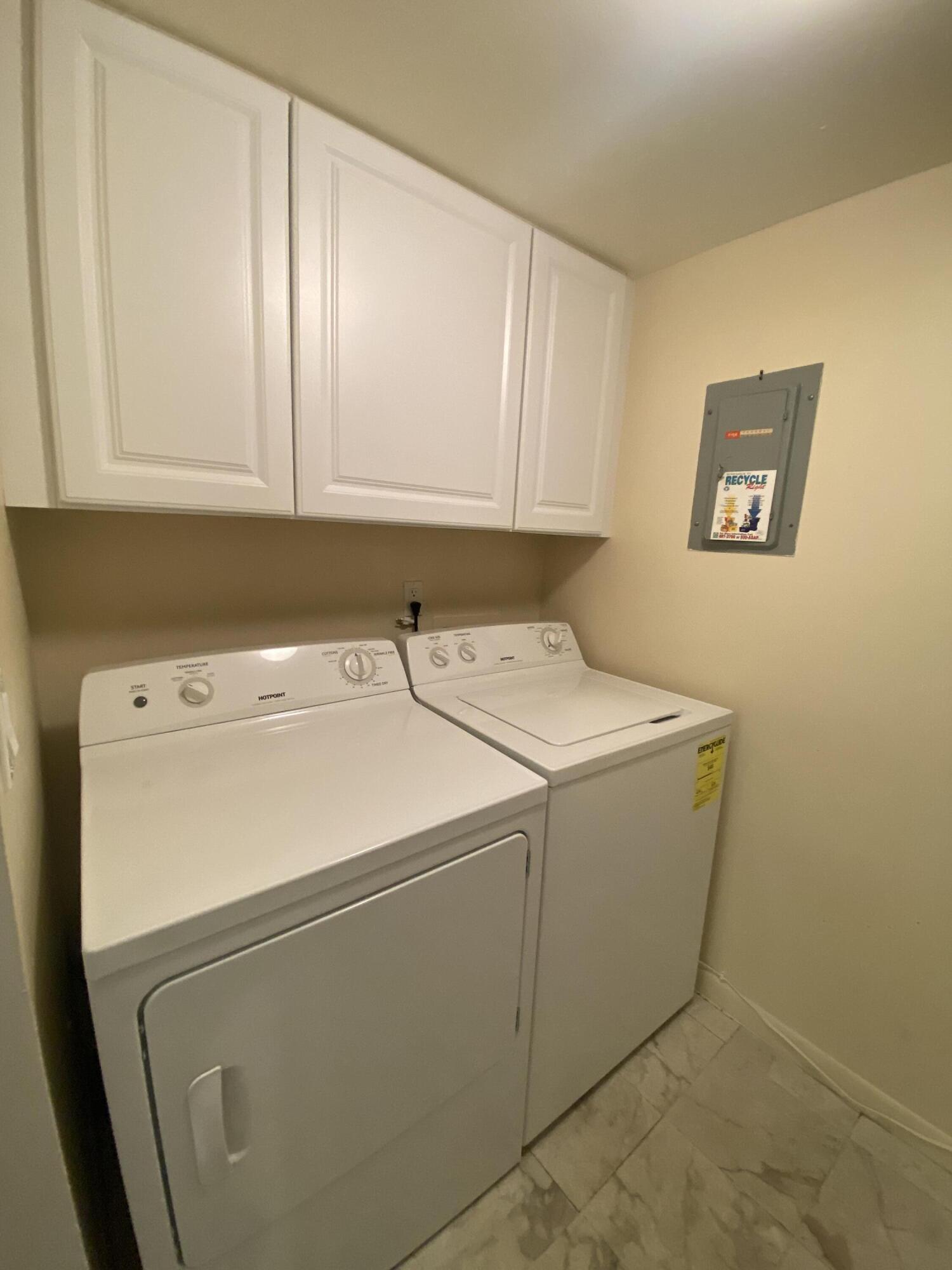 302 Pine Ridge Circle, Unit D1 Greenacres, FL 33463 - Photo 31 of 46 a utility room with dryer and washer