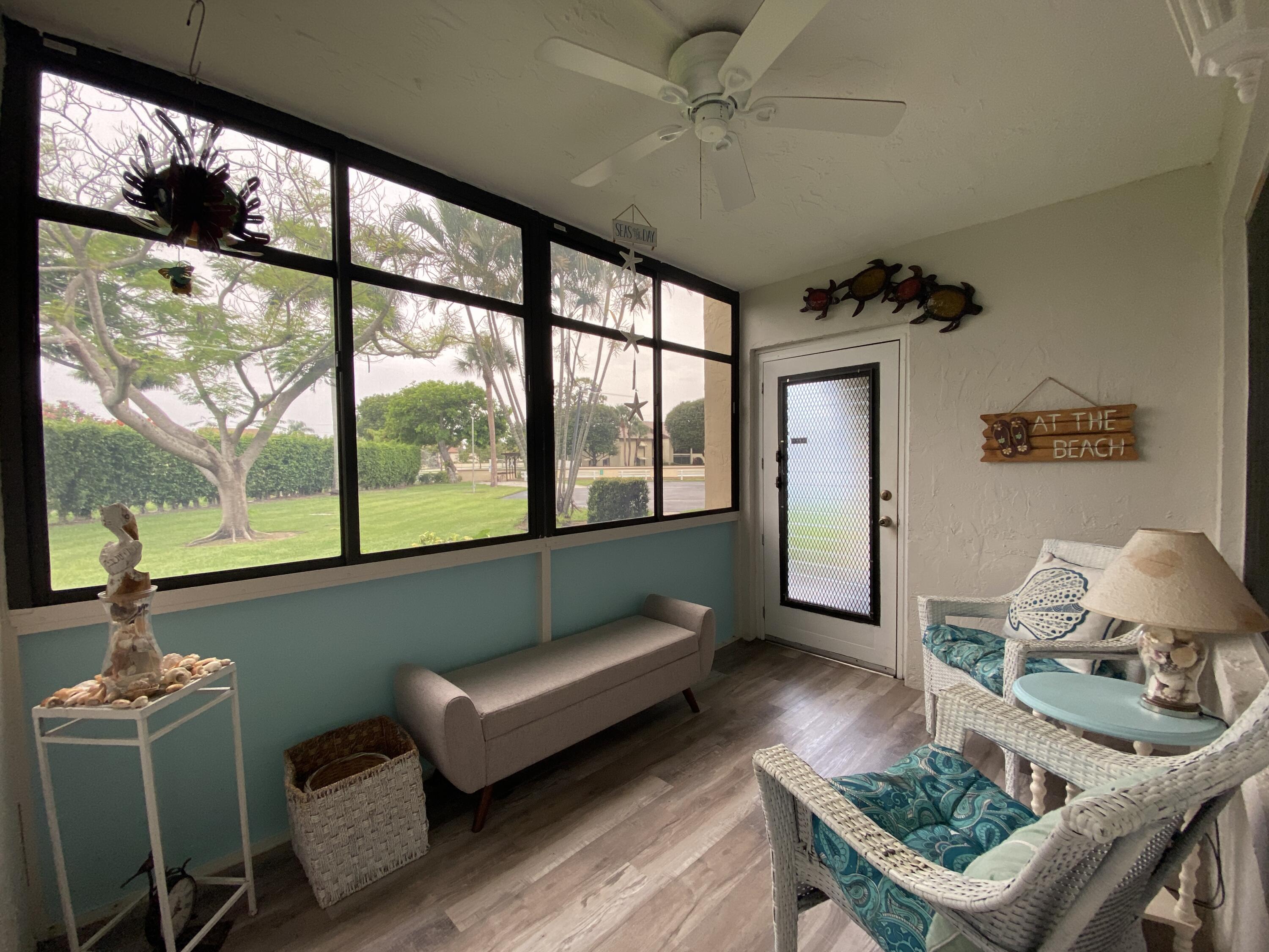 302 Pine Ridge Circle, Unit D1 Greenacres, FL 33463 - Photo 7 of 46 a living room with furniture and a large window
