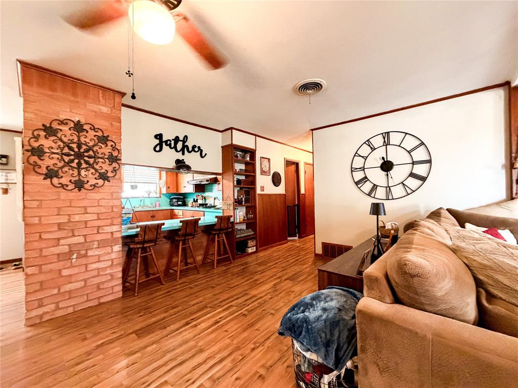 1706 North Ave H Haskell, TX 79521 - Photo 8 of 25 a living room with furniture and wooden floor
