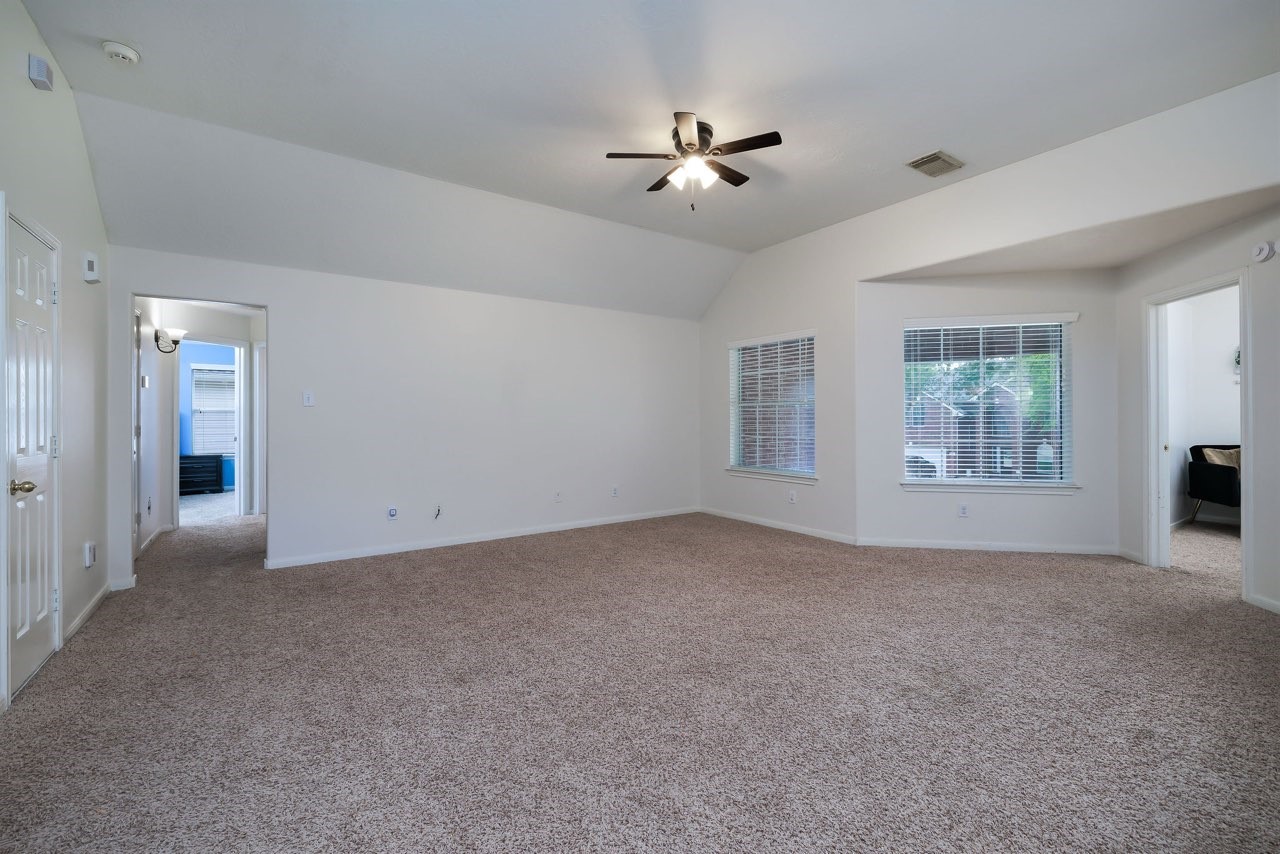 19 East Popular Pine Northeast Conroe, TX 77302 - Photo 17 of 20 a view of a livingroom with a window
