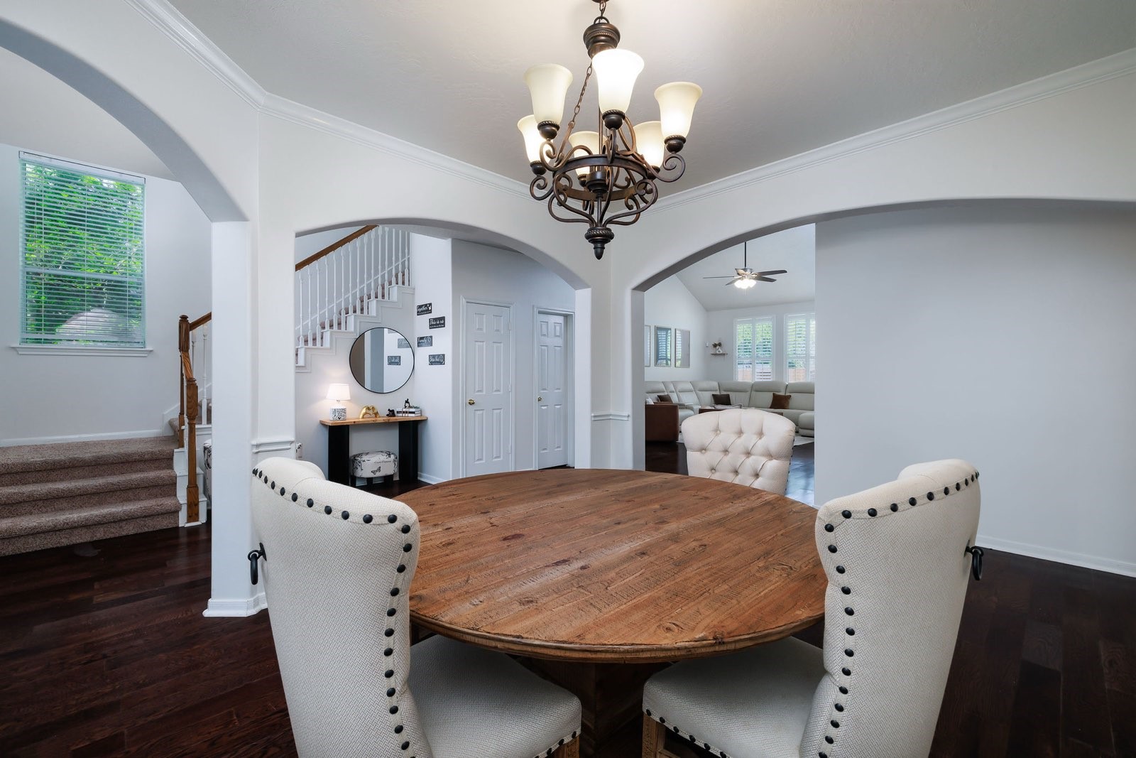 19 East Popular Pine Northeast Conroe, TX 77302 - Photo 5 of 20 a view of a dining room with furniture and a chandelier