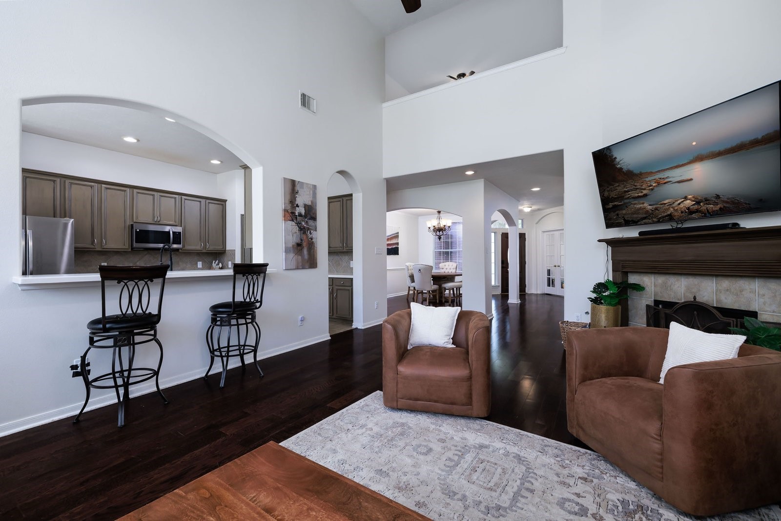 19 East Popular Pine Northeast Conroe, TX 77302 - Photo 10 of 20 a living room with furniture and a flat screen tv