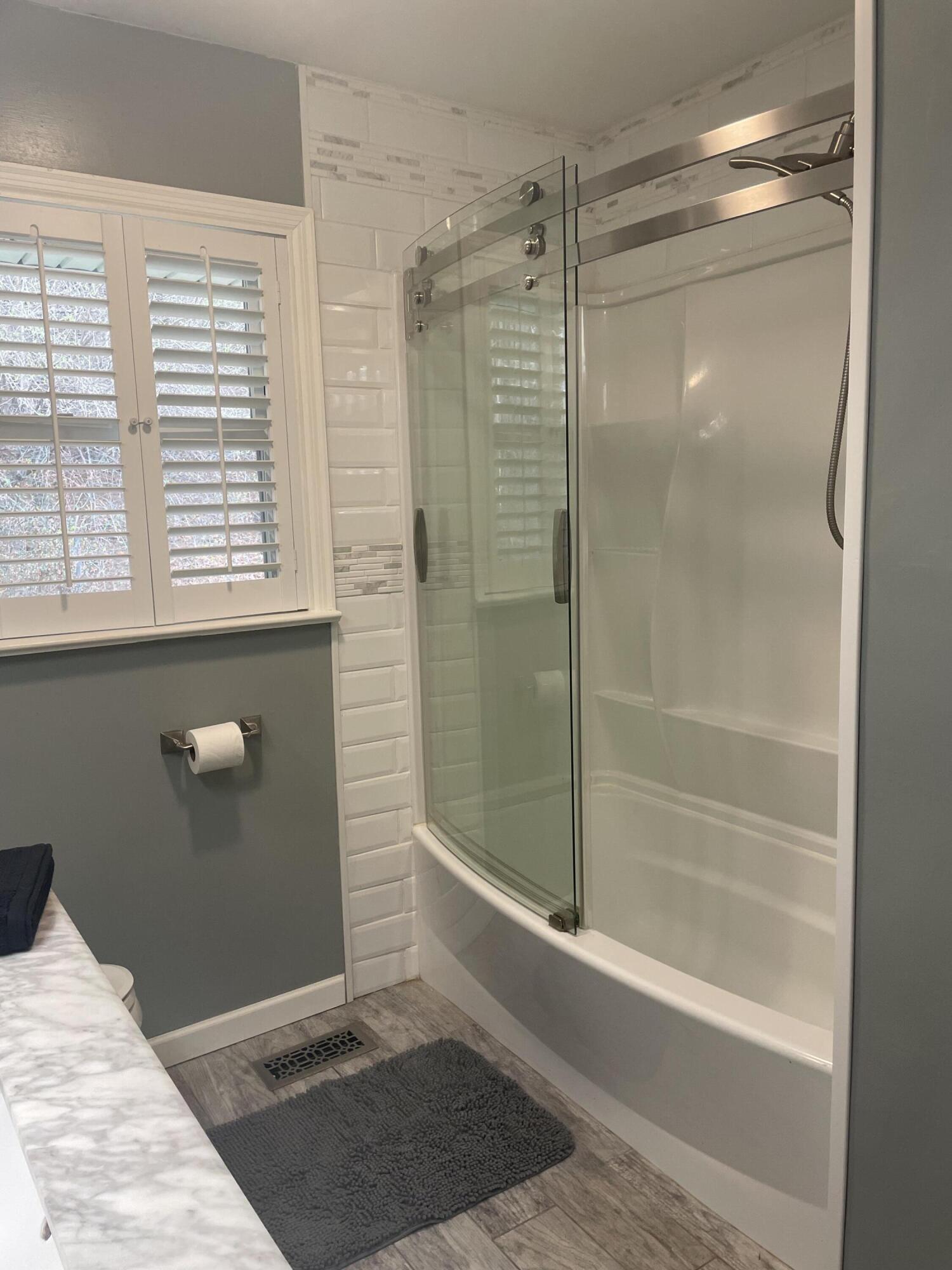 7592 Willow Branch Road Boones Mill, VA 24065 - Photo 13 of 47 a bathroom with a shower and a bathtub