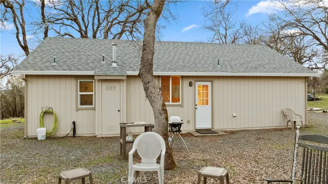 a house view with a backyard space
