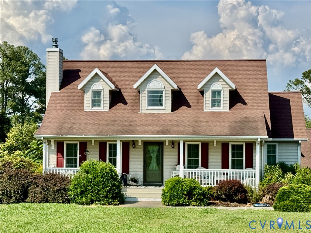 768 Hardtimes Road Farmville, VA 23901 - Photo 2 of 5 Dormered home exterior featuring a front porch wit