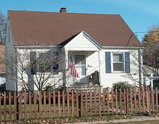 437 Reef Road, Unit 1 Fairfield, CT 06824 - Photo 1 of 1 a front view of a house with garden