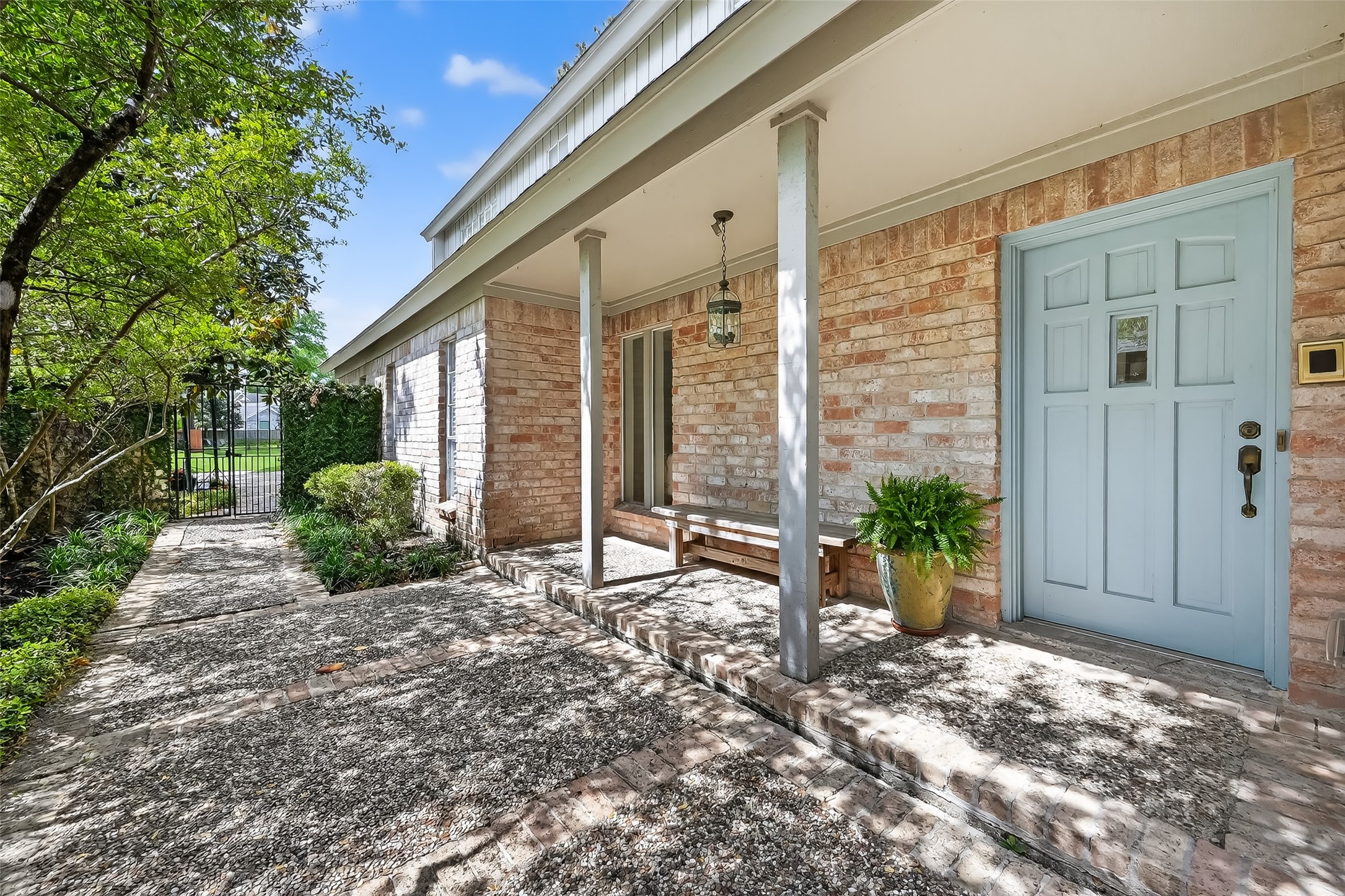 10022 Bayou Glen Road Houston, TX 77042 - Photo 4 of 43 Charming entrance with a serene walkway leading to an inviting front door.