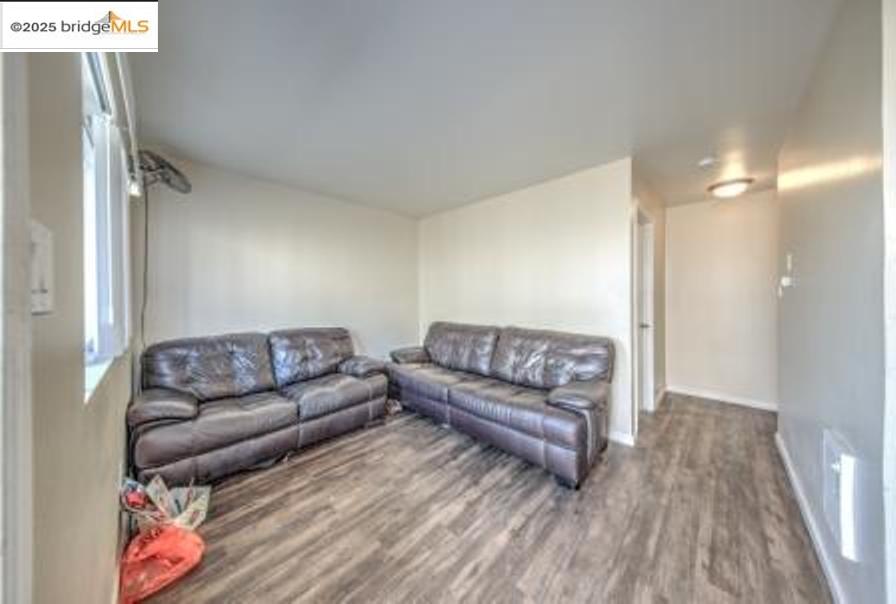 601 Alabama Street Vallejo, CA 94590 - Photo 12 of 17 a living room with furniture and a wooden floor