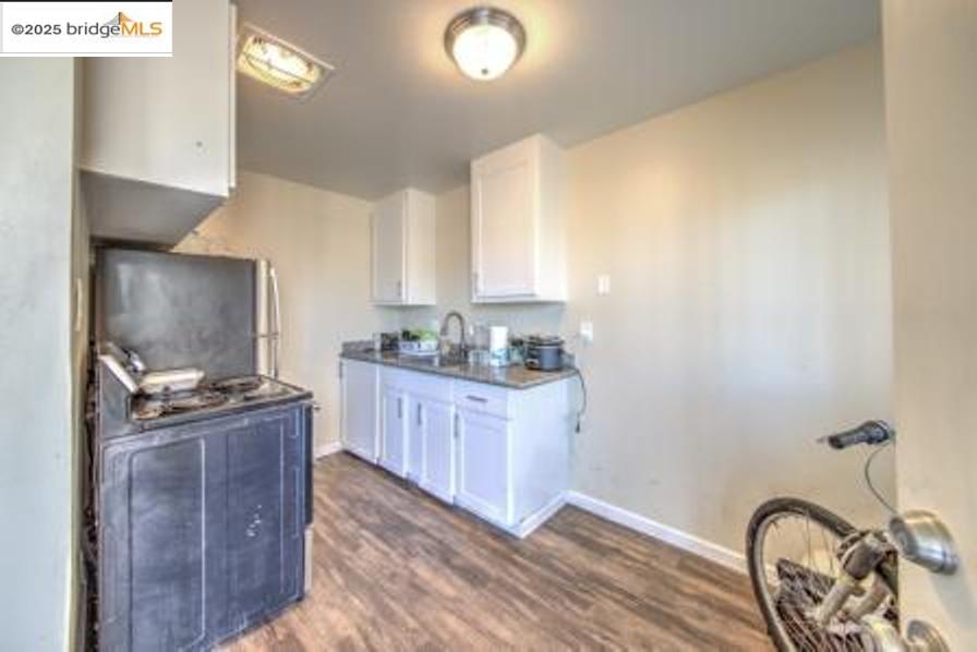 601 Alabama Street Vallejo, CA 94590 - Photo 13 of 17 a kitchen with a stove a sink and a refrigerator