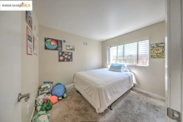 a kitchen with a refrigerator and a stove top oven