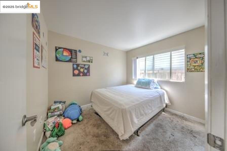 601 Alabama Street Vallejo, CA 94590 - Photo 15 of 17 a bedroom with a bed and a window