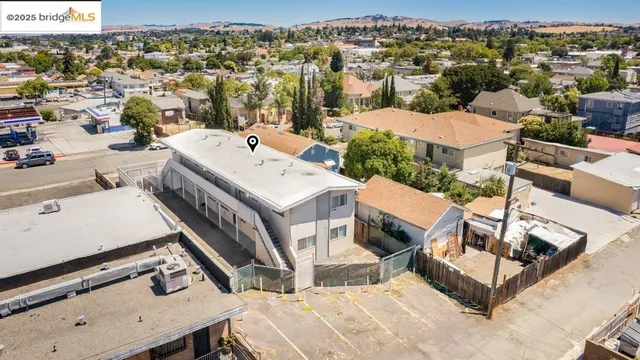 an aerial view of a house with yard