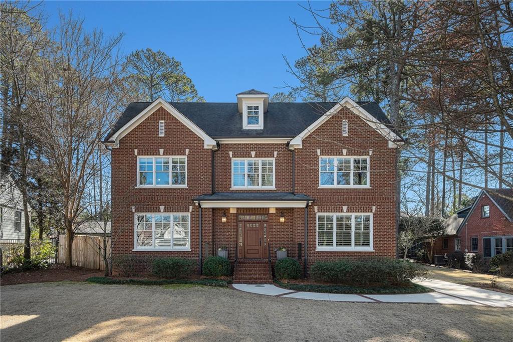 1723 Johnson Road Northeast Atlanta, GA 30306 - Photo 1 of 1 a front view of a house with a yard