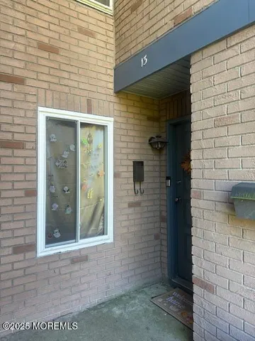 a view of a brick house with a door