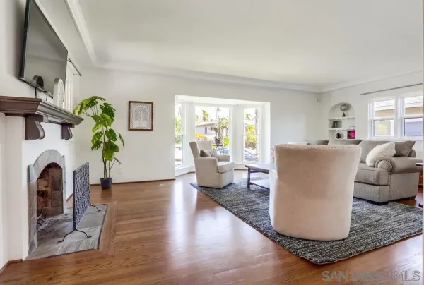 a kitchen with stainless steel appliances a refrigerator a stove top oven a sink dishwasher and white cabinets