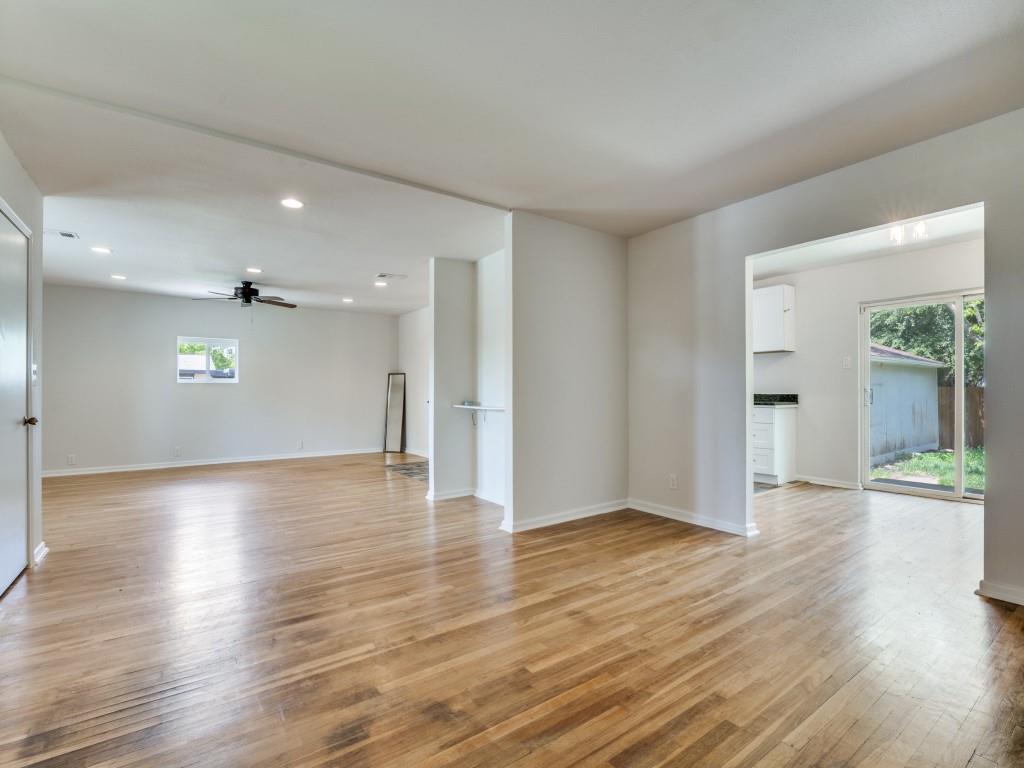 2315 Inadale Avenue Dallas, TX 75228 - Photo 7 of 36 a view of an empty room with wooden floor and a window