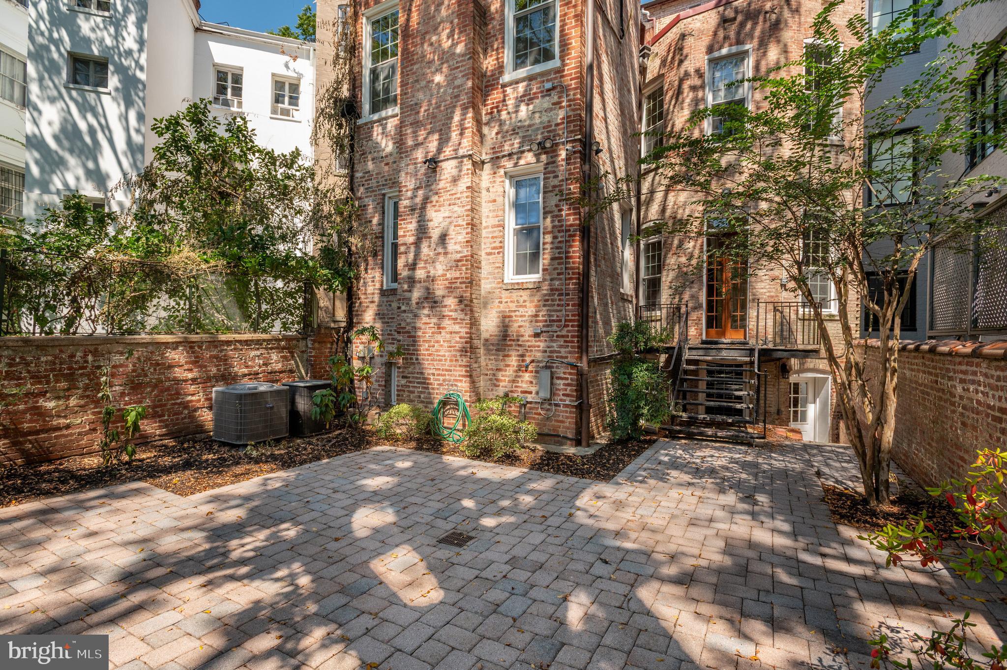 2232 Massachusetts Avenue Northwest Washington, DC 20008 - Photo 20 of 21 a view of a backyard with sitting area and furniture