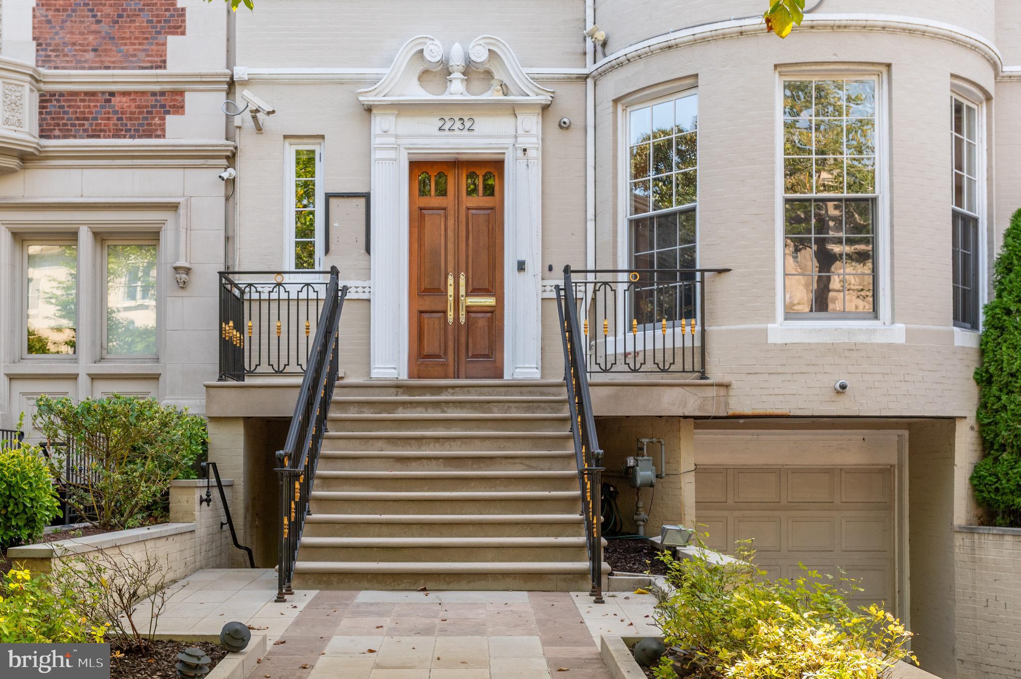 2232 Massachusetts Avenue Northwest Washington, DC 20008 - Photo 3 of 21 a front view of a house with a porch