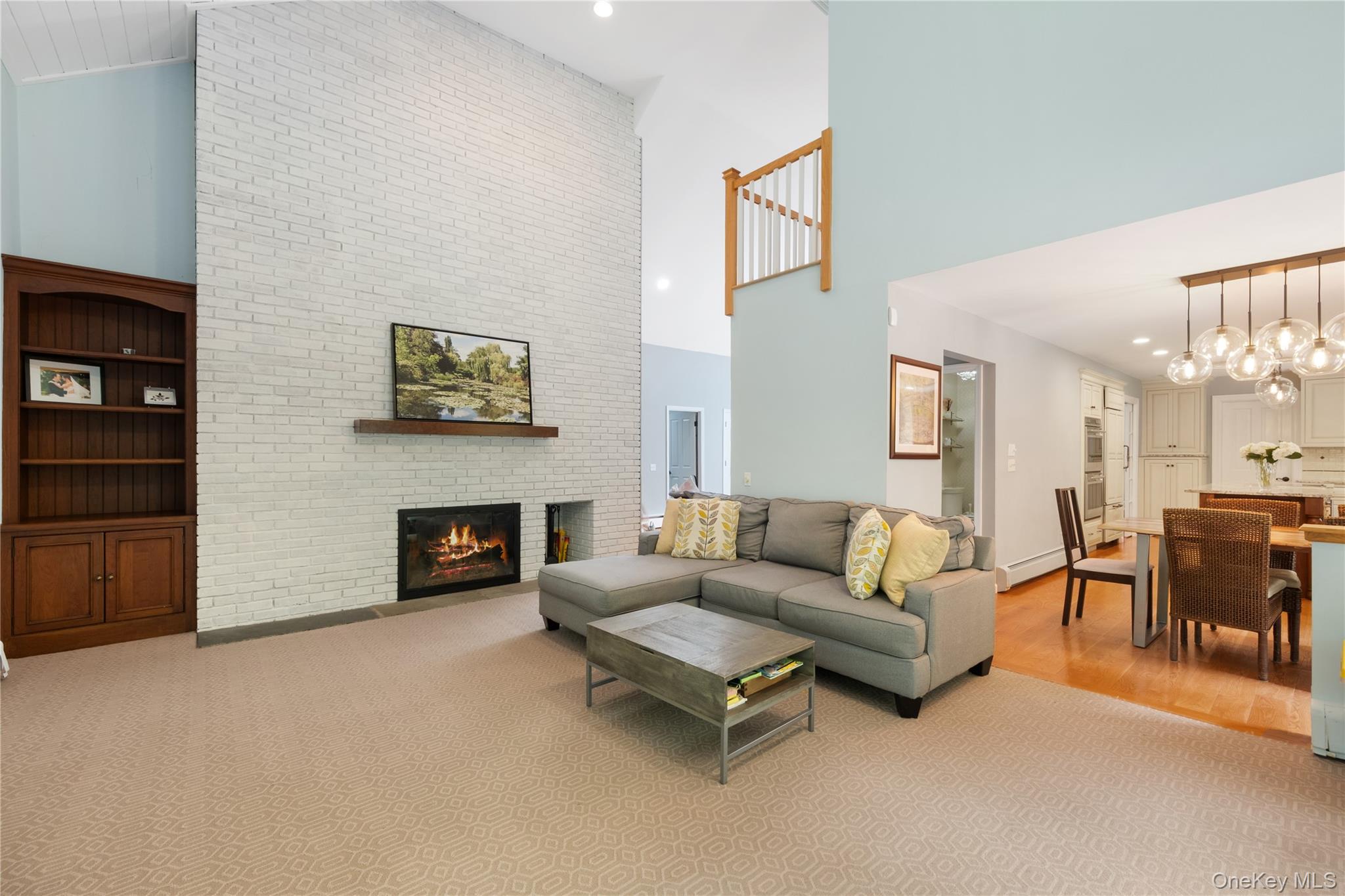3 Breckenridge Road Chappaqua, NY 10514 - Photo 34 of 34 Family room with fireplace and view of open floor plan