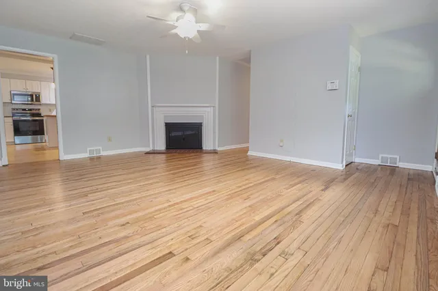 a view of a balcony with wooden floor