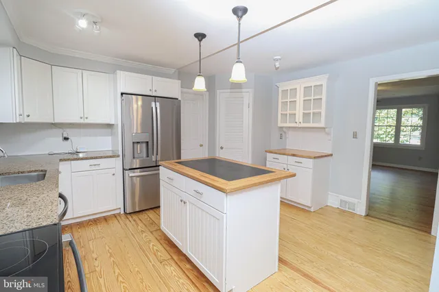 a view of a park with large trees