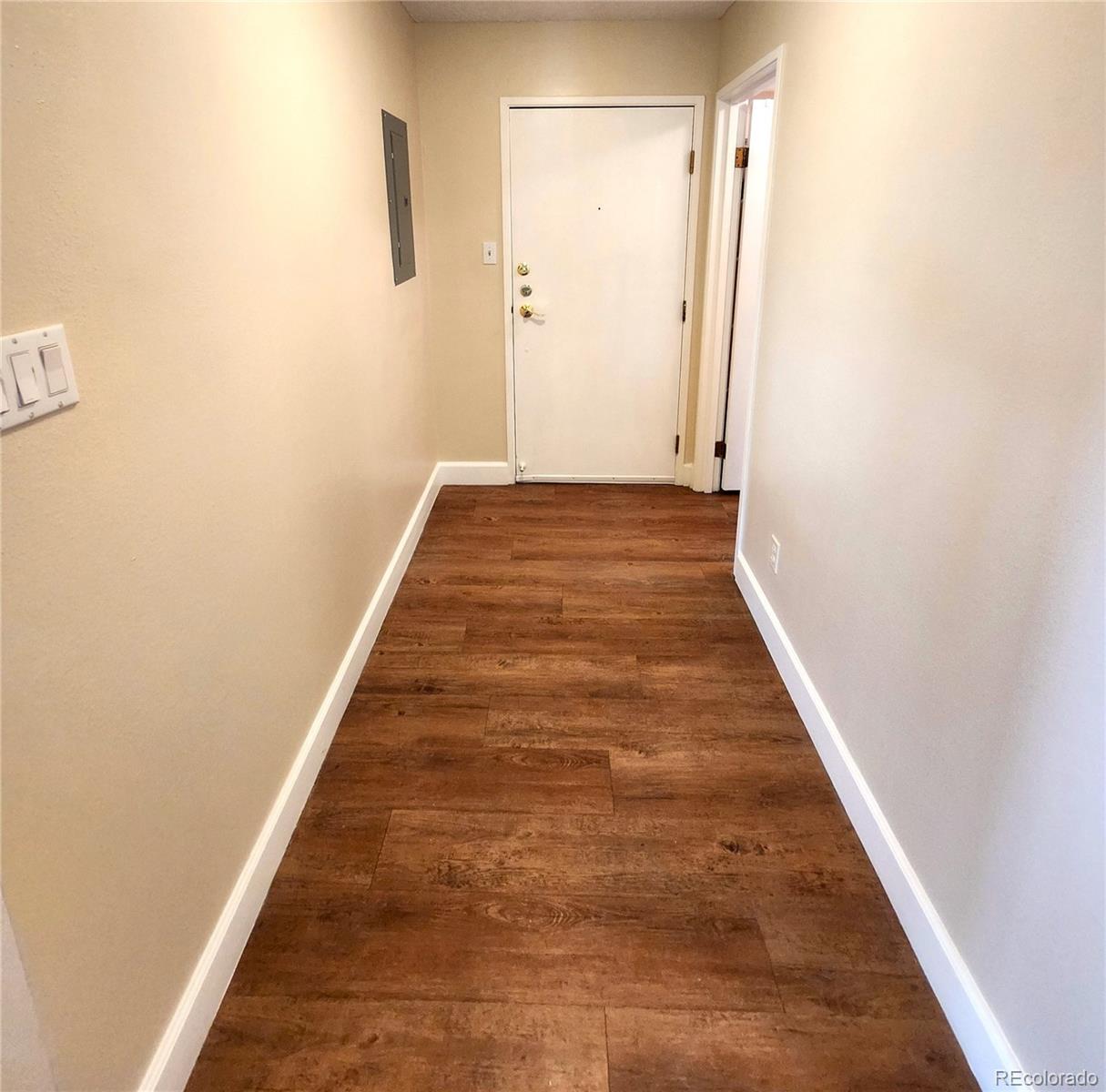 13890 East Marina Drive, Unit 602 Aurora, CO 80014 - Photo 13 of 27 a view of a hallway with wooden floor