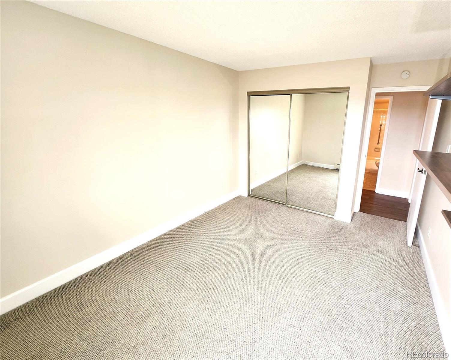 13890 East Marina Drive, Unit 602 Aurora, CO 80014 - Photo 15 of 27 an empty room with a natural light