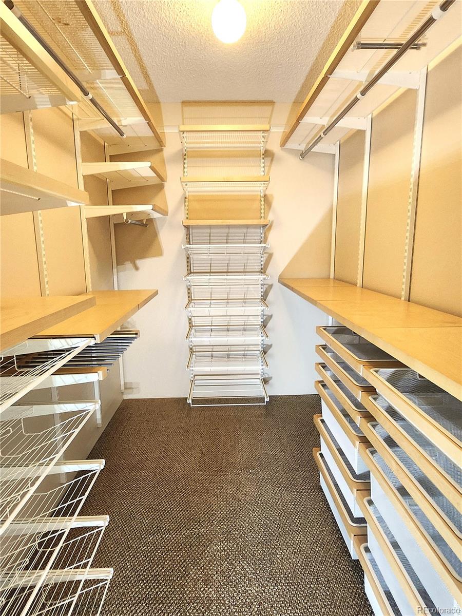 13890 East Marina Drive, Unit 602 Aurora, CO 80014 - Photo 16 of 27 a view of walk in closet with empty racks