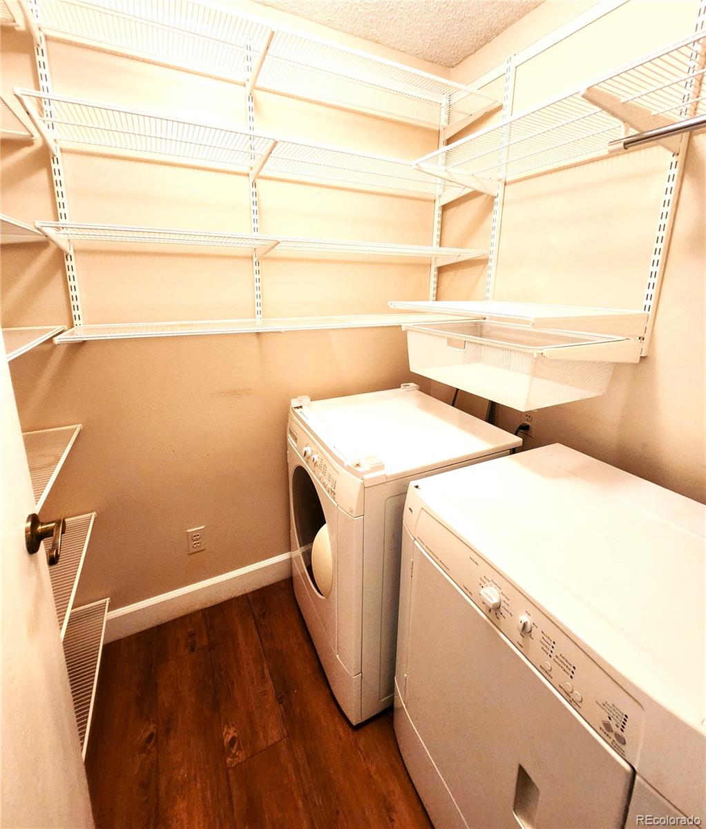 13890 East Marina Drive, Unit 602 Aurora, CO 80014 - Photo 17 of 27 a utility room with dryer and washer