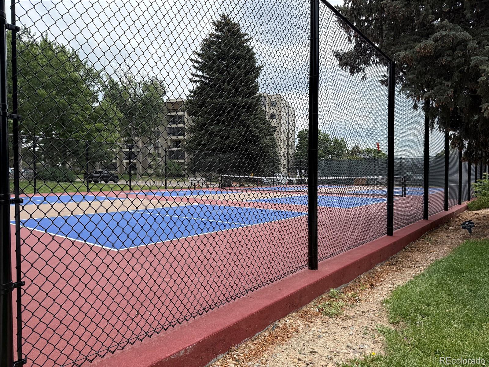 13890 East Marina Drive, Unit 602 Aurora, CO 80014 - Photo 23 of 27 a view of a tennis court