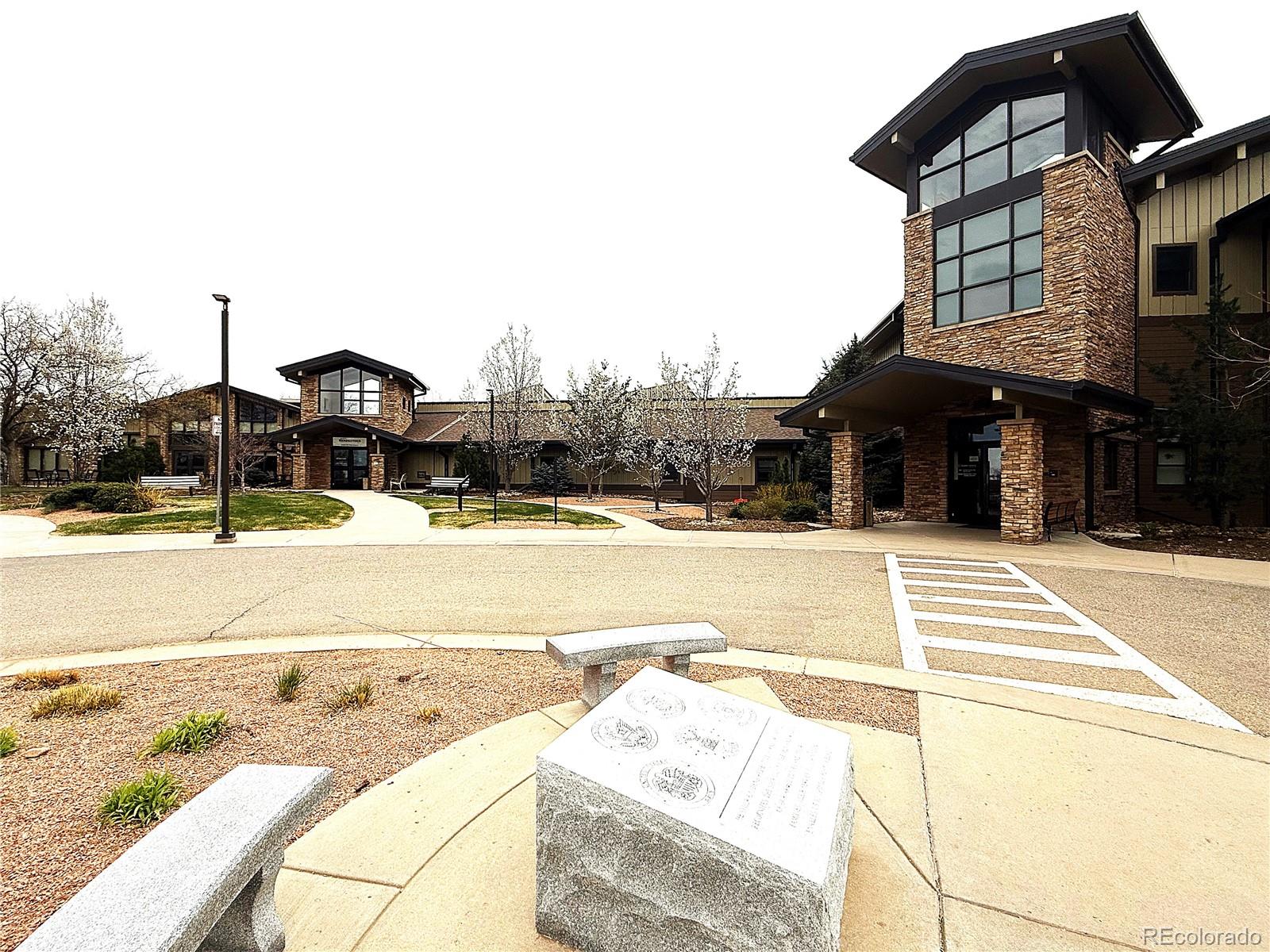 13890 East Marina Drive, Unit 602 Aurora, CO 80014 - Photo 26 of 27 a view of a swimming pool with a lounge chairs