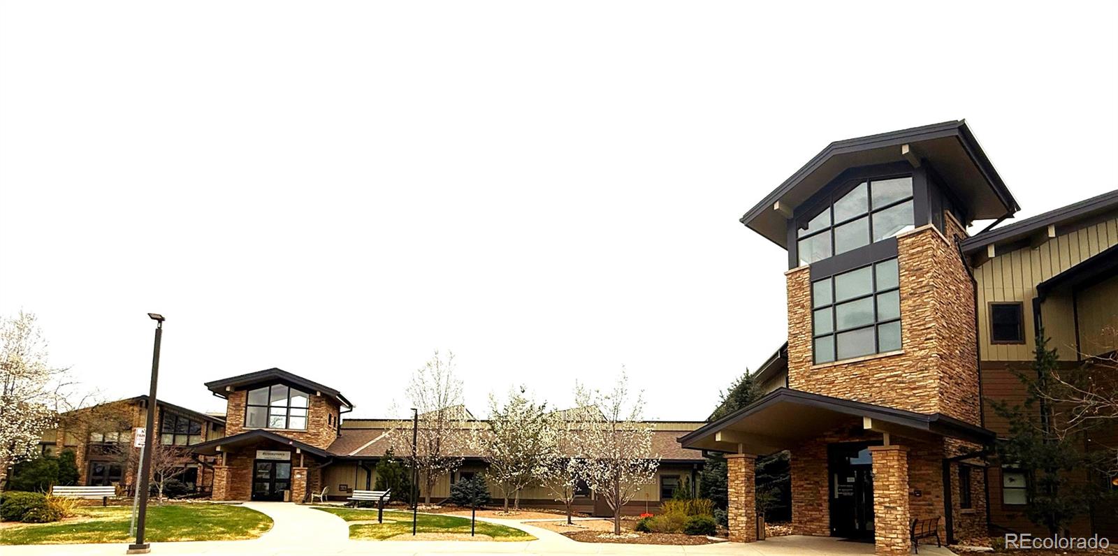 13890 East Marina Drive, Unit 602 Aurora, CO 80014 - Photo 27 of 27 a front view of a building with street