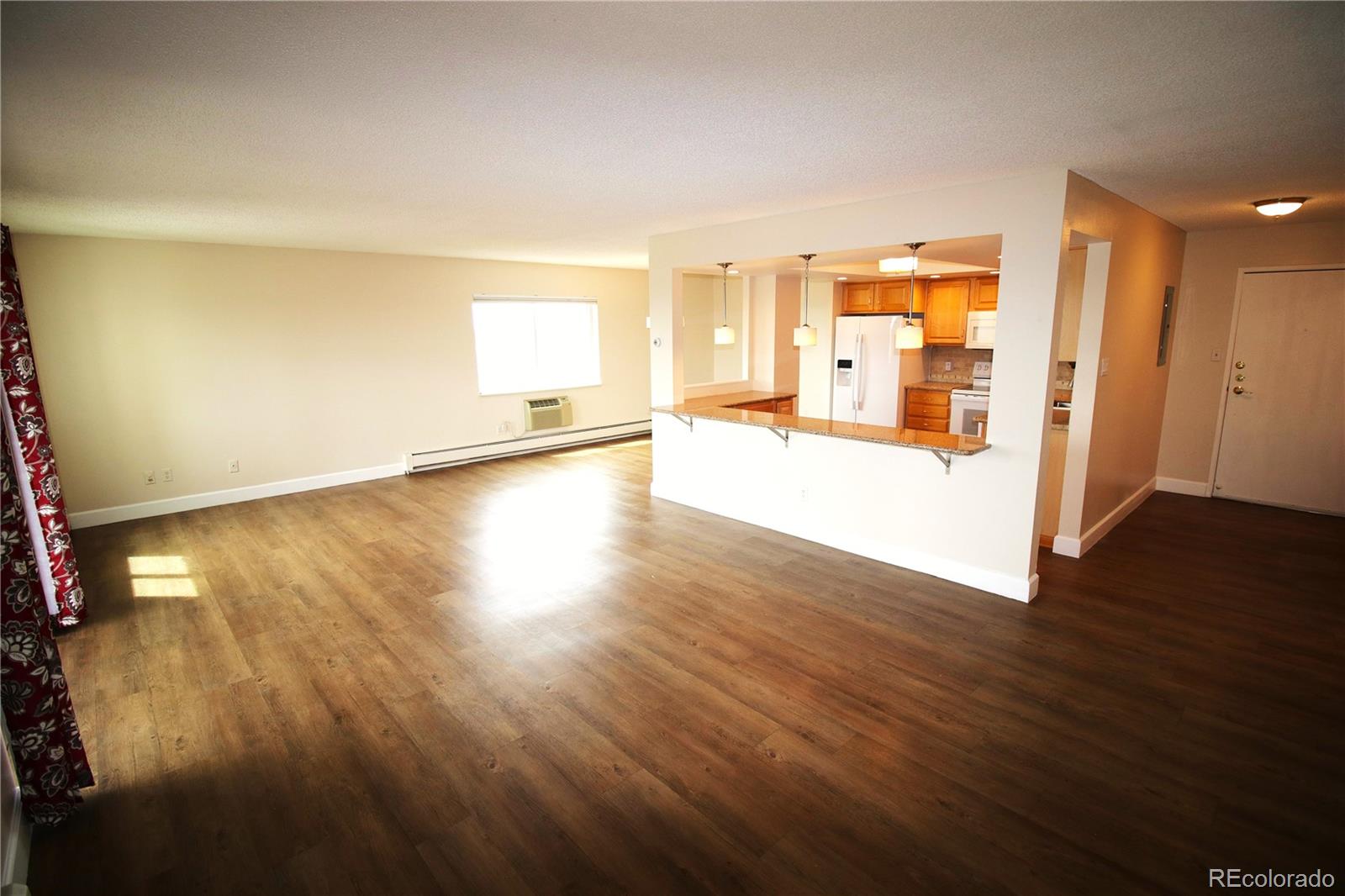 13890 East Marina Drive, Unit 602 Aurora, CO 80014 - Photo 3 of 27 a view of a kitchen with wooden floor and a window