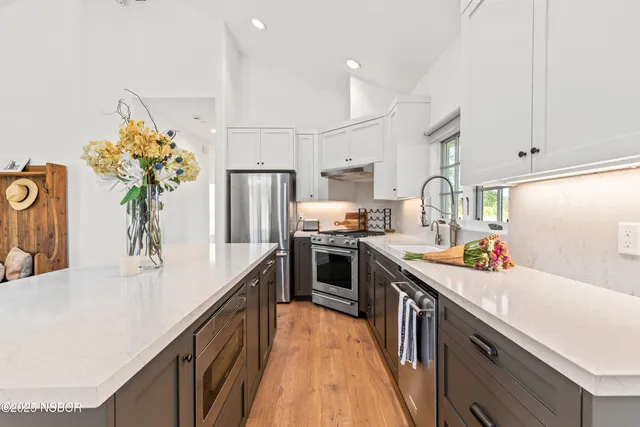 a kitchen with a sink and large window