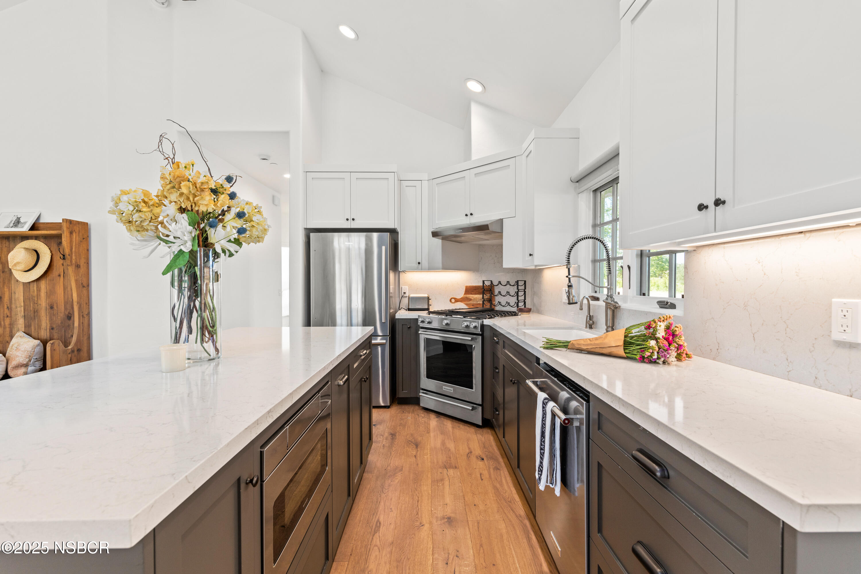 1740 Still Meadow Road Solvang, CA 93463 - Photo 14 of 43 a kitchen with stainless steel appliances a sink dishwasher a refrigerator a stove top oven a chimney and cabinets